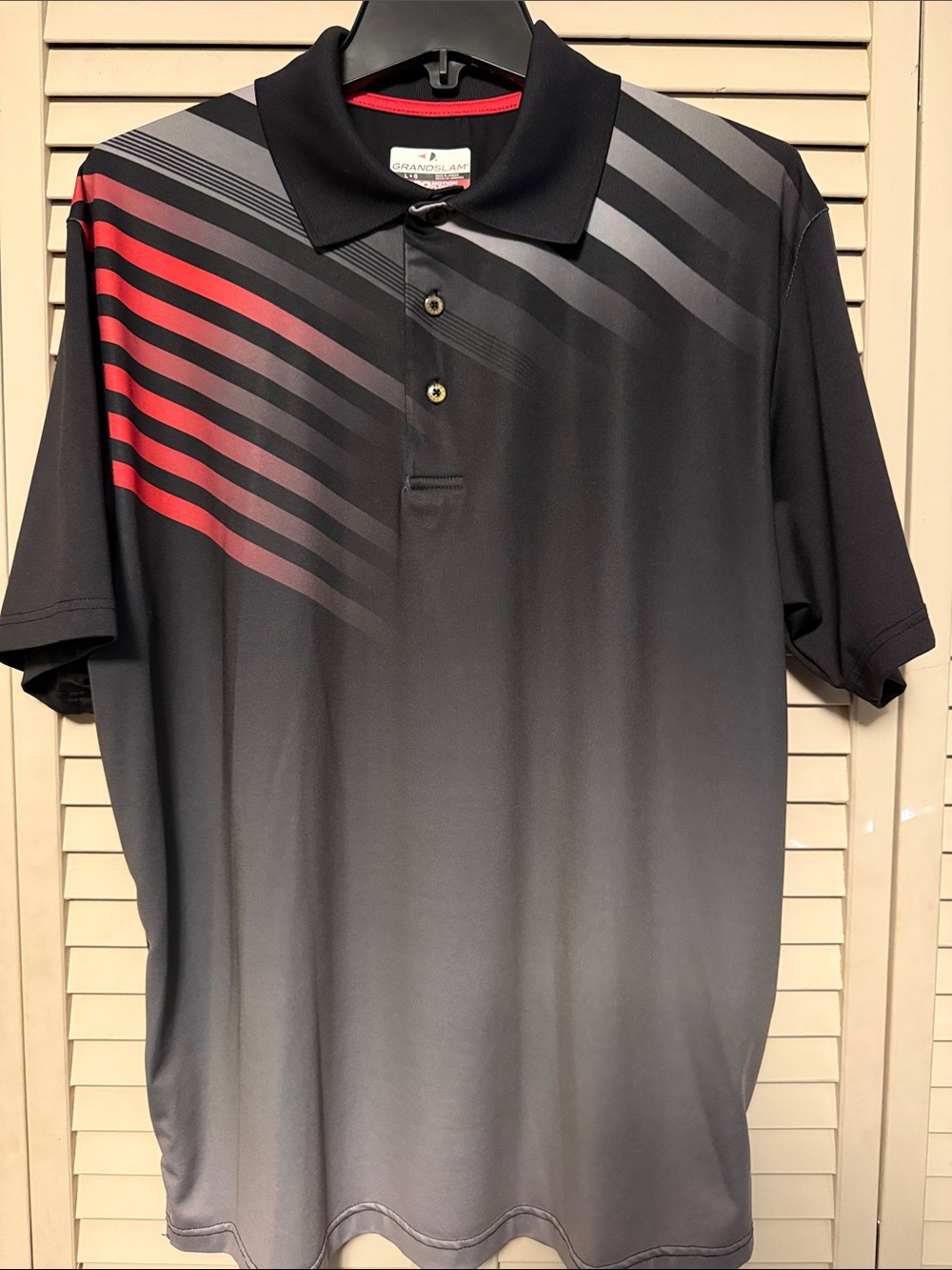 Grand Slam Black Polo with Red and Gray Diagonal Stripes